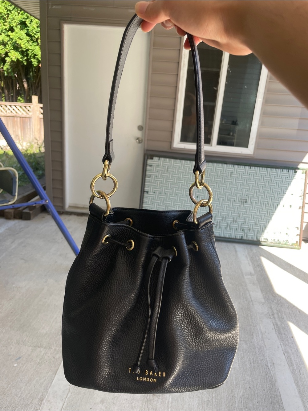 Ted Baker Black Pebbled Leather Drawstring Bucket Bag with lilac Striped Strap